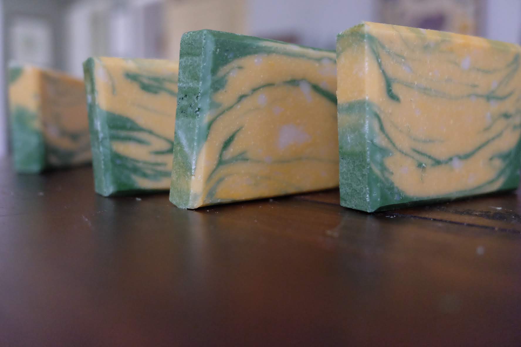 Row of green and yellow marbled soap bars
