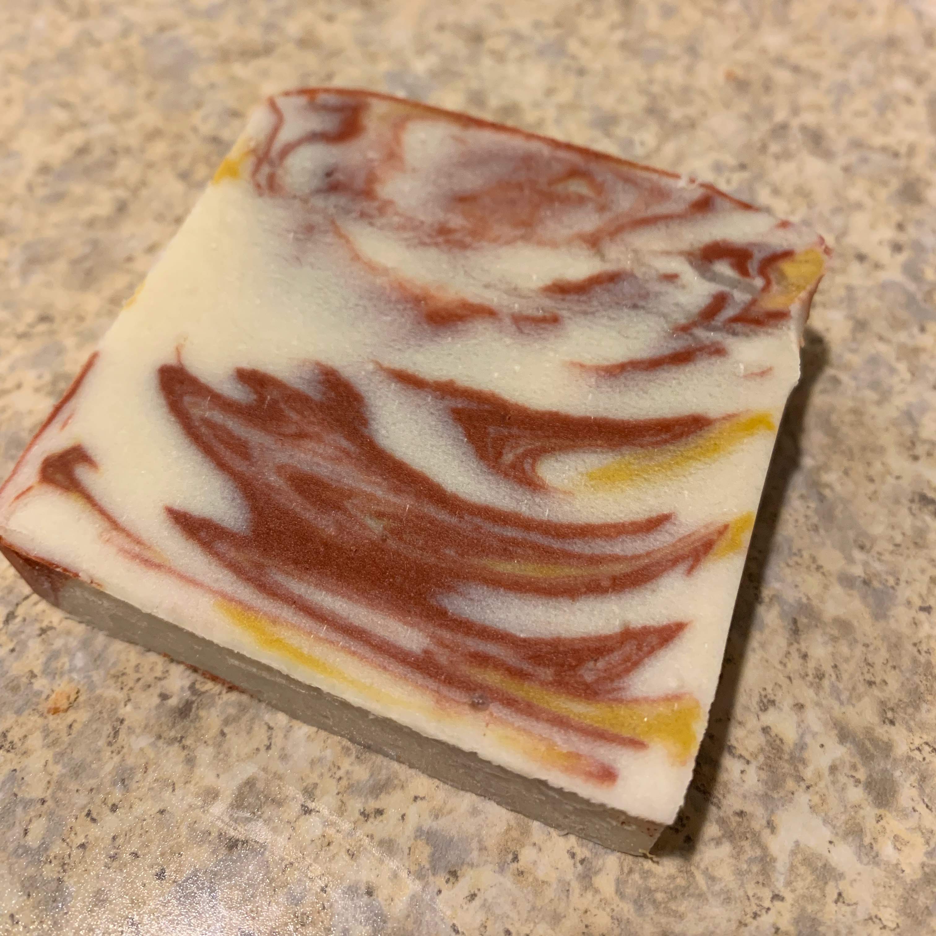 Red and yellow marbled soap bar